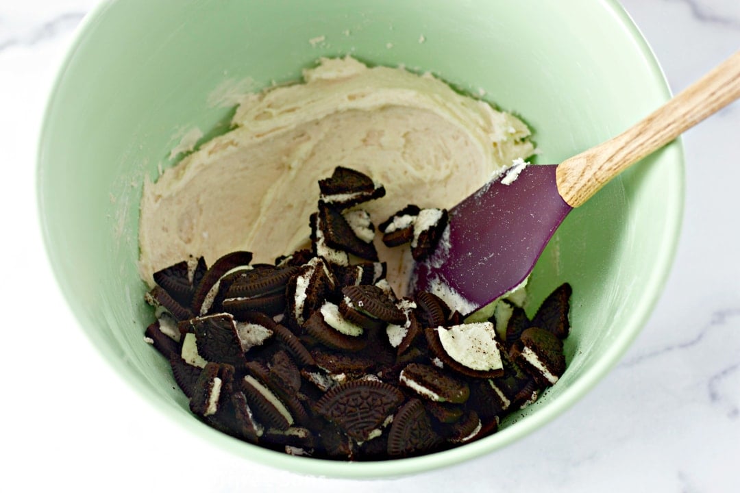 stirring oreos into the cookie dough