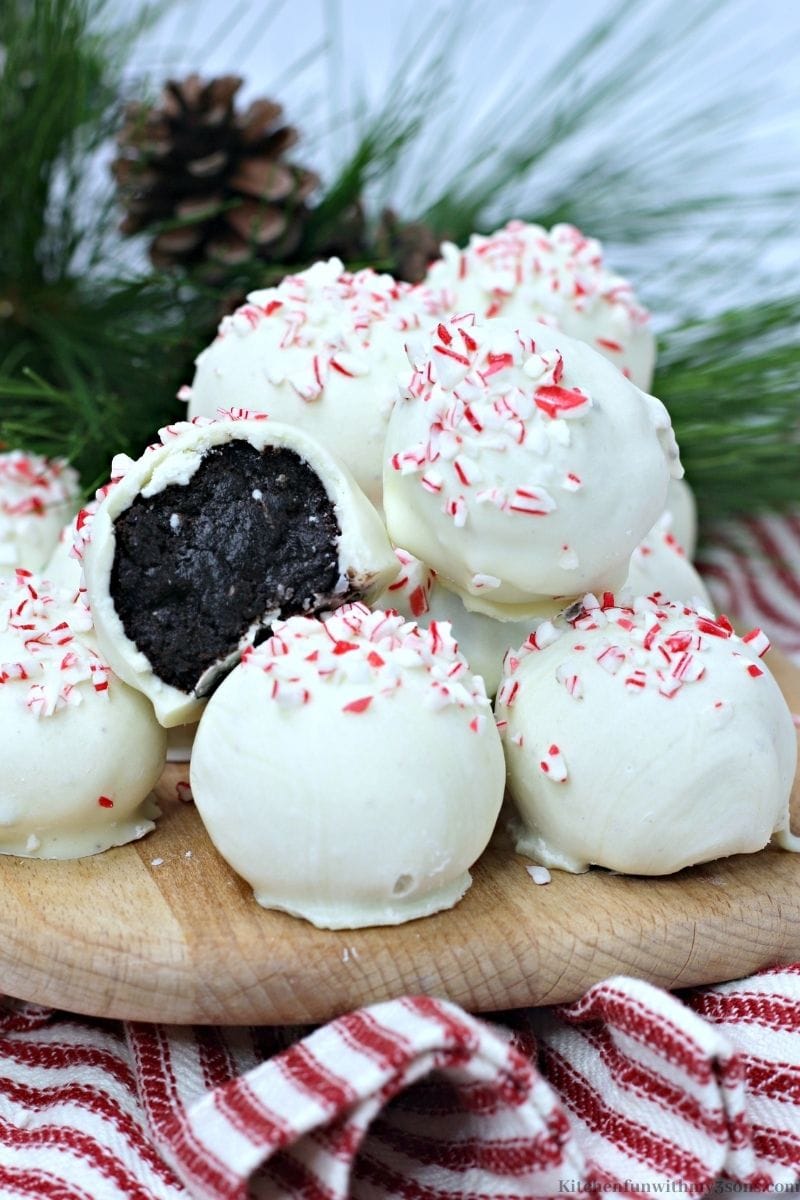 Peppermint Oreo Truffles stacked on top of each other.