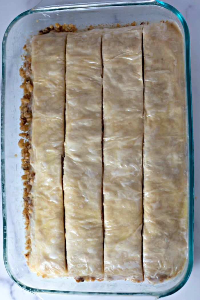 cutting the layers of phyllo dough