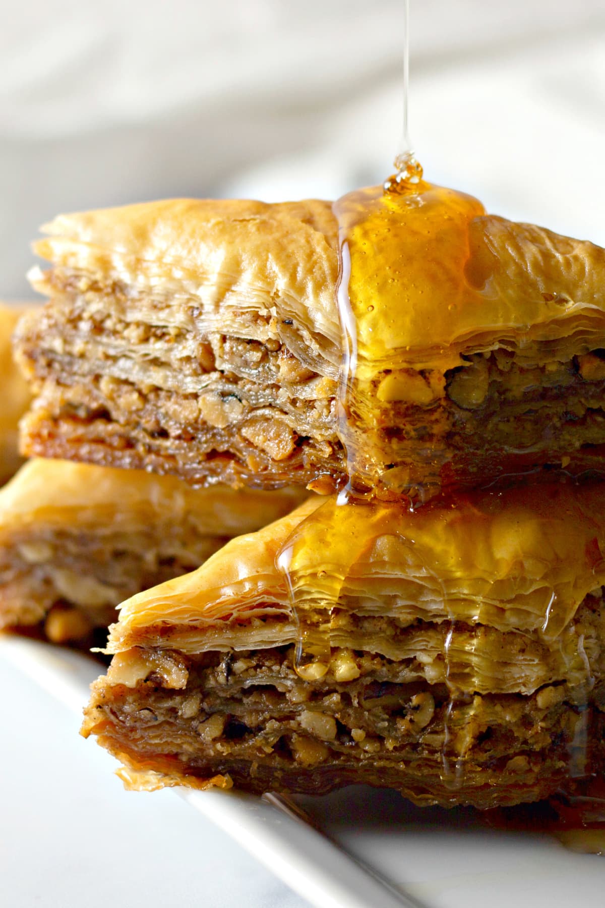 Baklava with honey drizzled on top