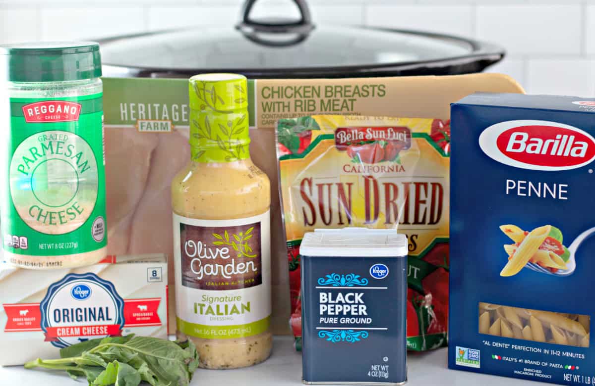 This Olive Garden Chicken Pasta is made in the slow cooker with tender shredded chicken that's cooked in Olive Garden Italian dressing, parmesan cheese, cream cheese, and sun dried tomatoes, then tossed with penne pasta and fresh basil. olive garden chicken pasta ingredients