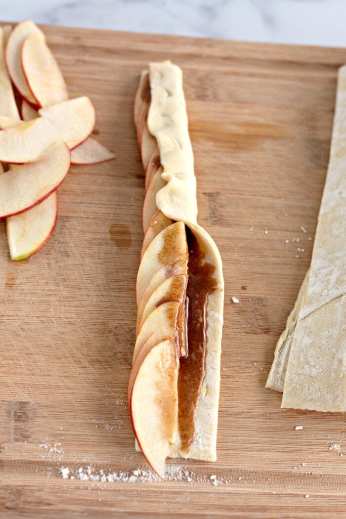 folding puff pastry over apples