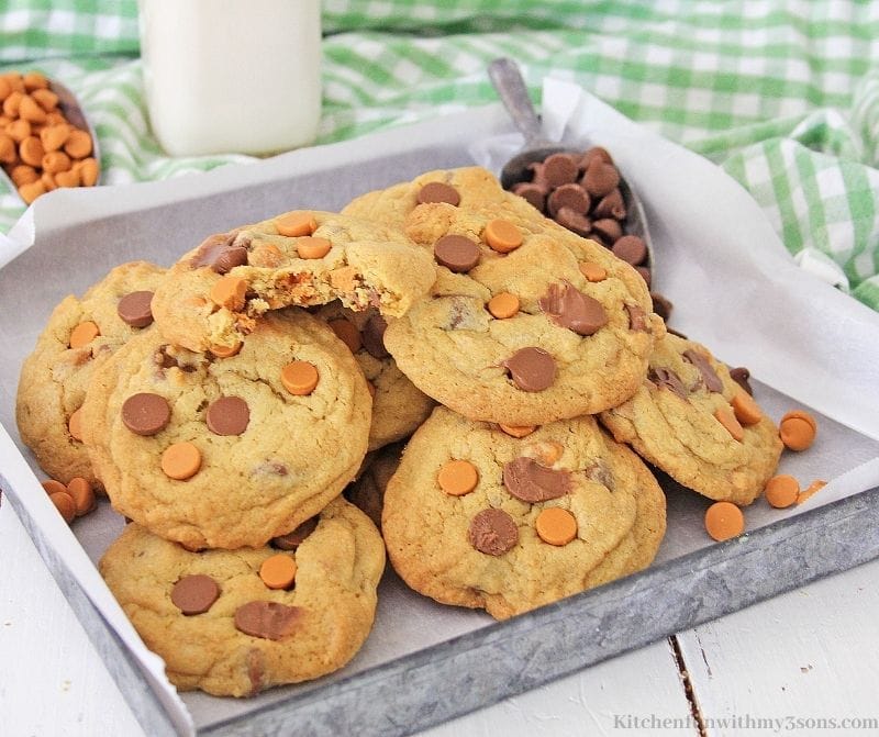 Chocolate Chip Butterscotch Cookies on a cookie sheet with parchment paper.