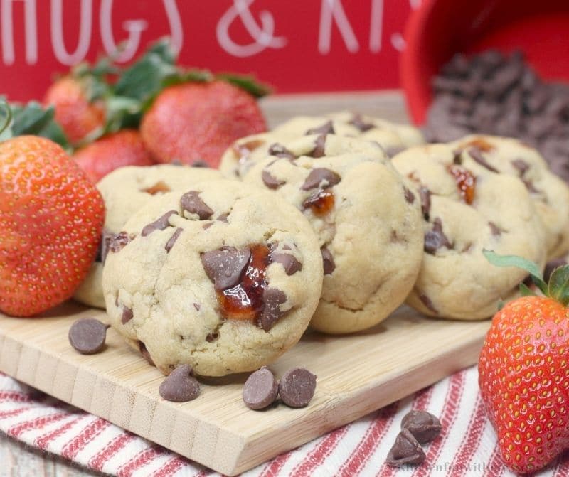 Chocolate Covered Strawberry Cookies on a wooden board.