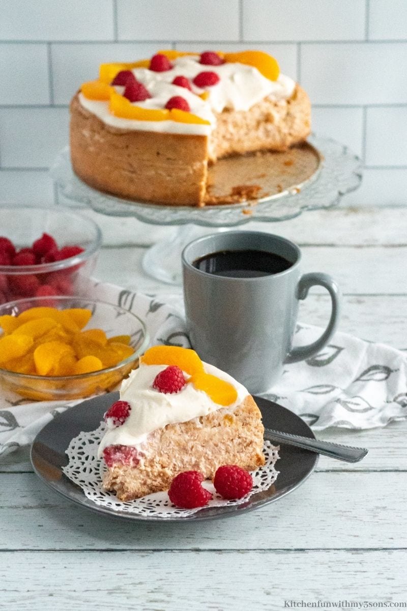 Instant Pot Peach Swirl Cheesecake with a slice of cheesecake taken out of it.
