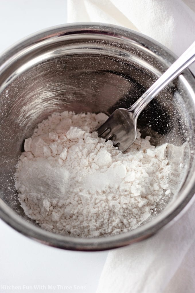 mixing dry ingredients together in a small metal bowl