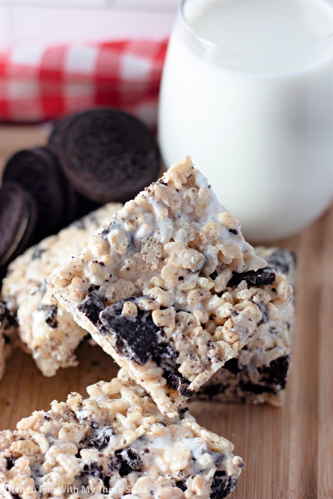 Oreo Rice Krispie Treats next to a glass of milk