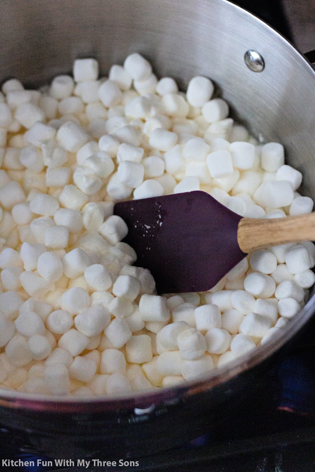 melting marshmallows and butter in a large pot