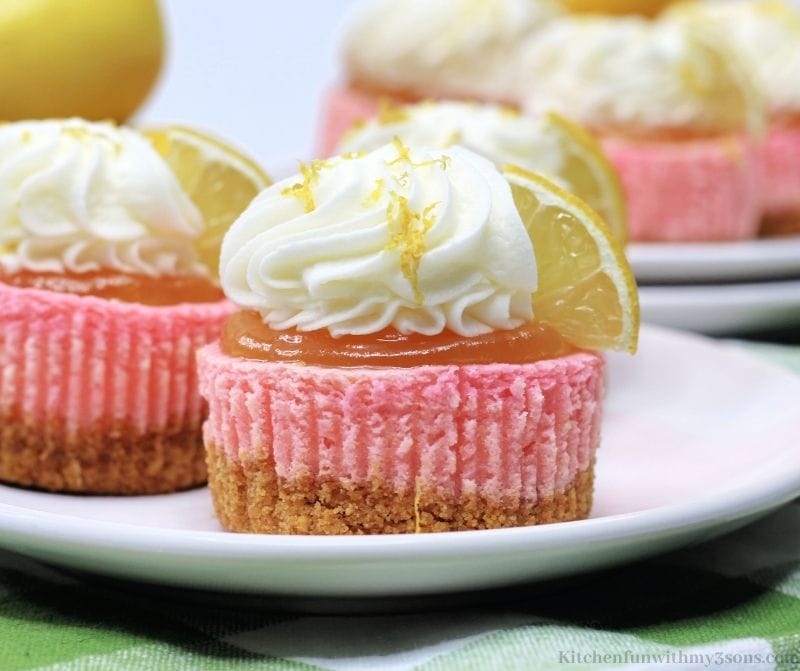 Pink Lemonade Mini Cheesecakes on a white serving plate.