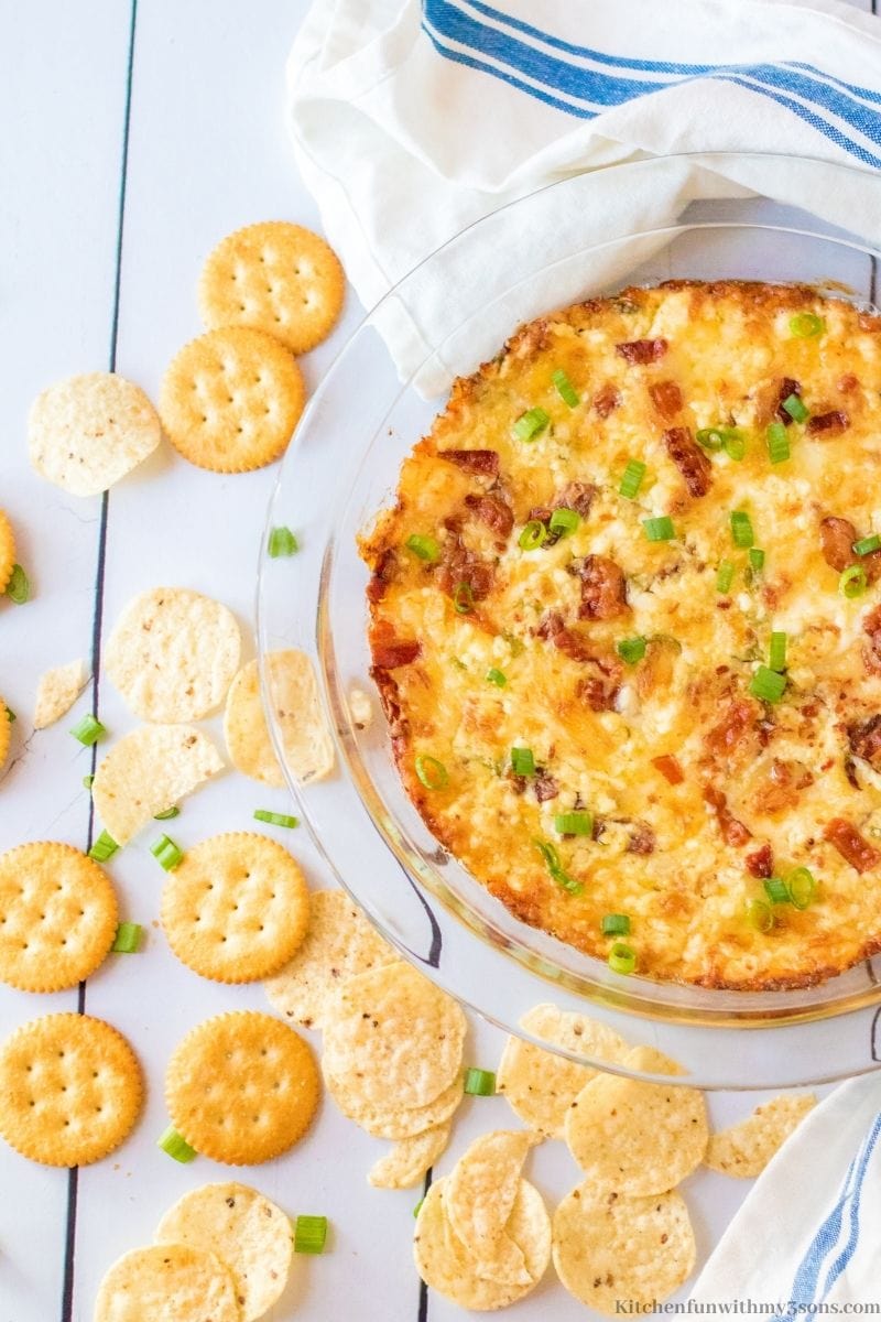 Savory Bacon Swiss Dip Recipe with a bunch of crackers on the side.