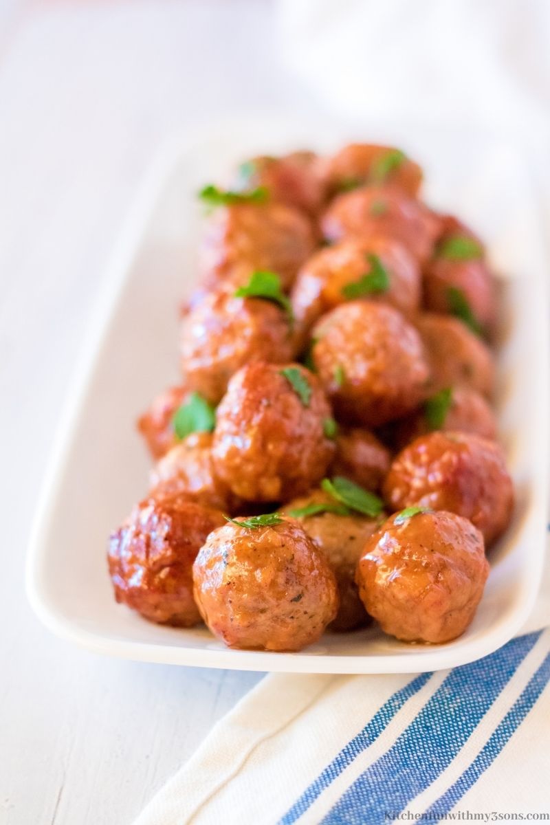 The meatballs on a white serving platter.