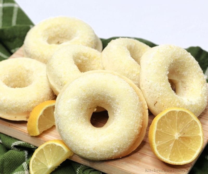 Sugared Lemon Donuts on a wooden board.