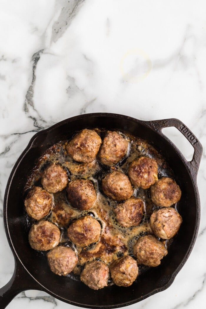 Homemade meatballs in a cast iron skillet