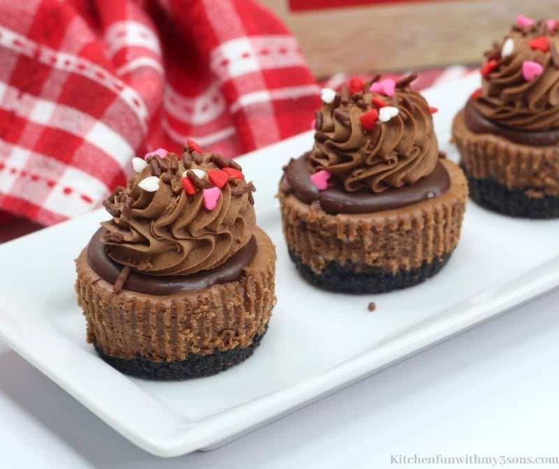 Valentine's Day Mini Chocolate Cheesecakes on a white serving platter.