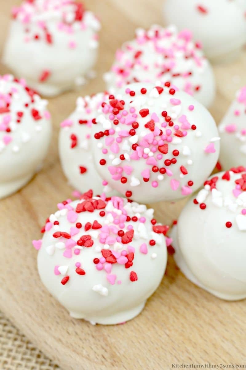 Valentine's Day Red Velvet Cake Balls with sprinkles on top.