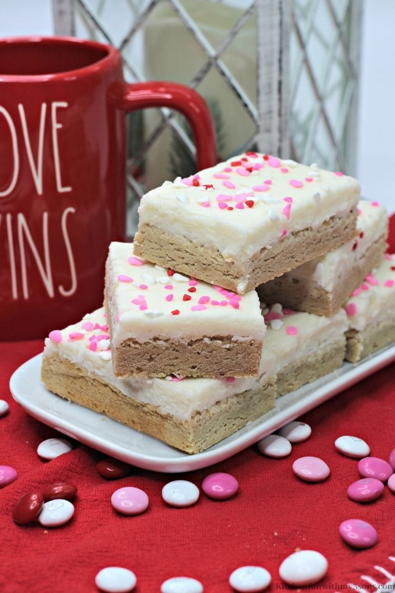 Valentine's Day Snickerdoodle Cookie Bar with sprinkled M&M's around them.