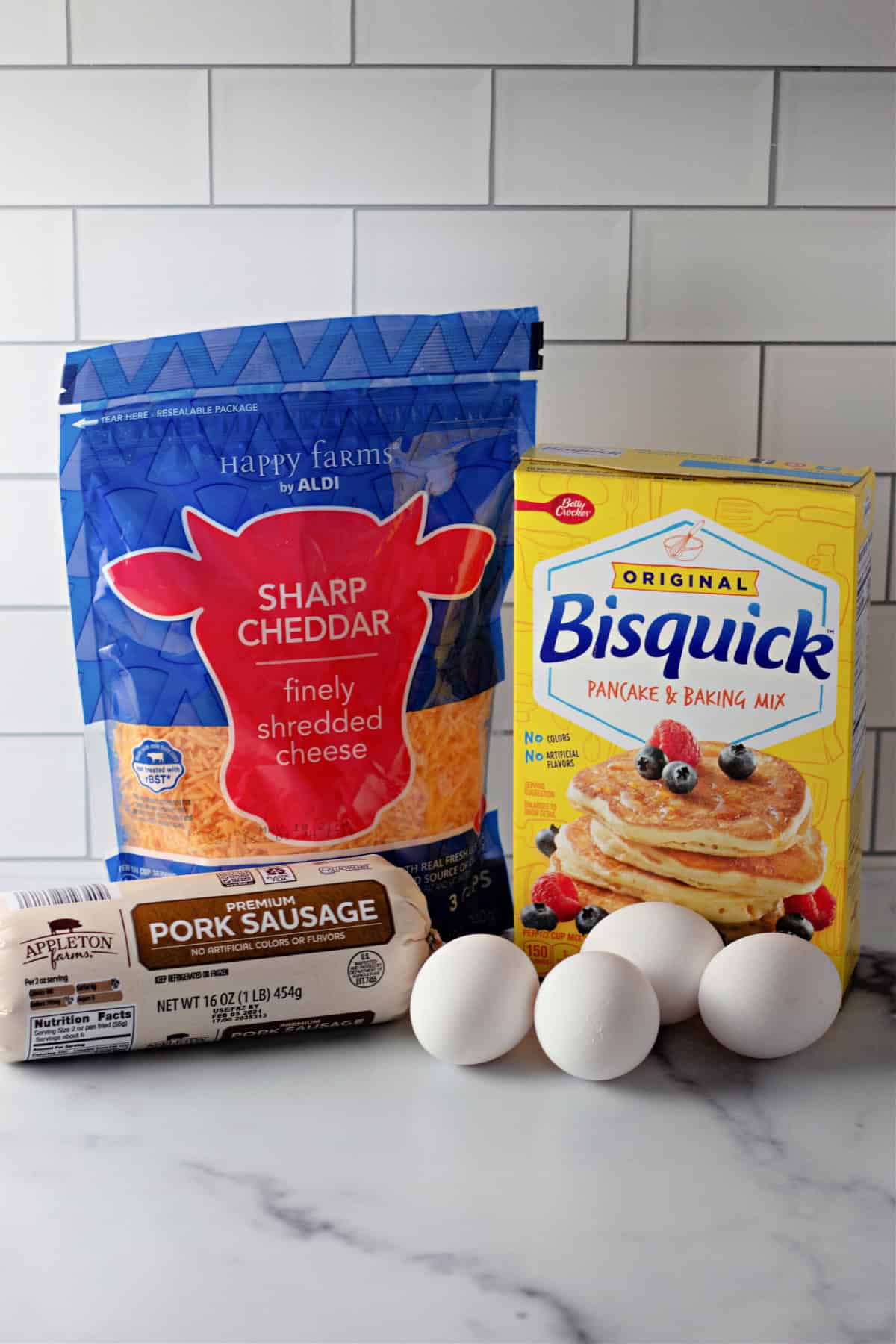 These easy Sausage Breakfast Muffins are packed with savory sausage, fluffy eggs, melted cheddar cheese, and Bisquick for the ultimate grab-and-go breakfast. ingredients for sausage breakfast muffins