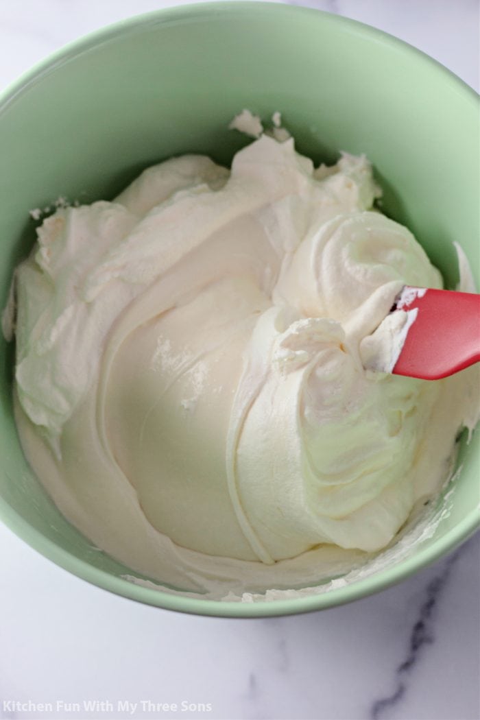 Whipped topping in a green bowl
