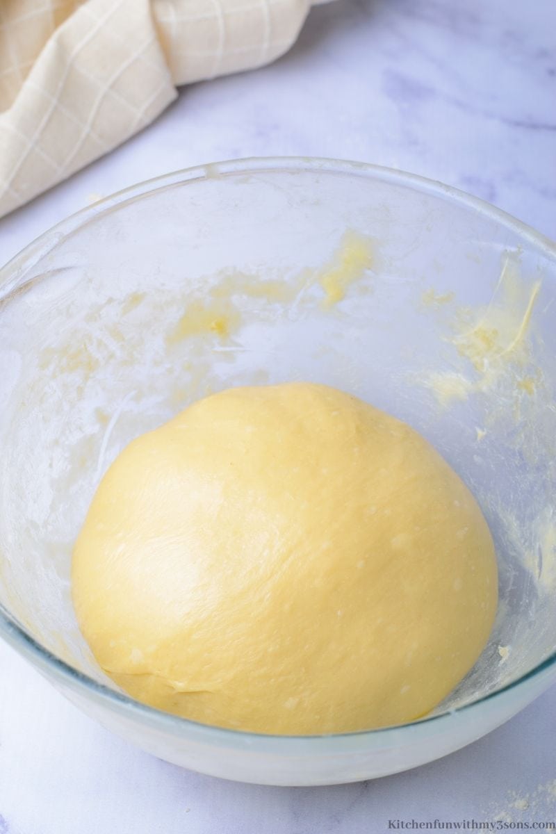 The butter making a smooth and glossy dough mound.