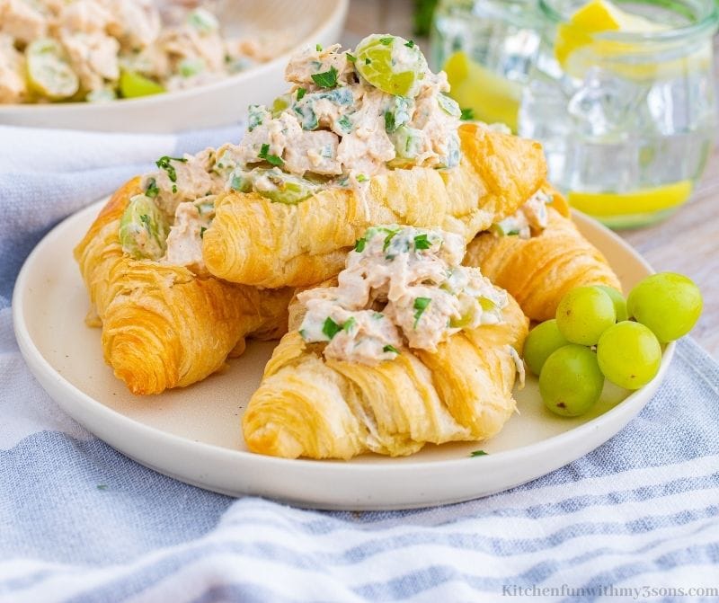 The chicken salad in crescent rolls on a serving plate.