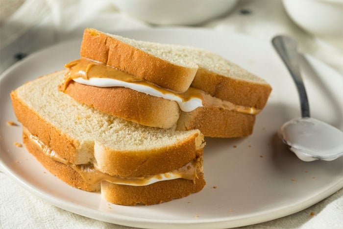 A Fluffernutter Sandwich brings back to many memories of childhood and I love sharing it with my own kids. Two layers of bread with a delicious layer of peanut butter and marshmallow fluff.