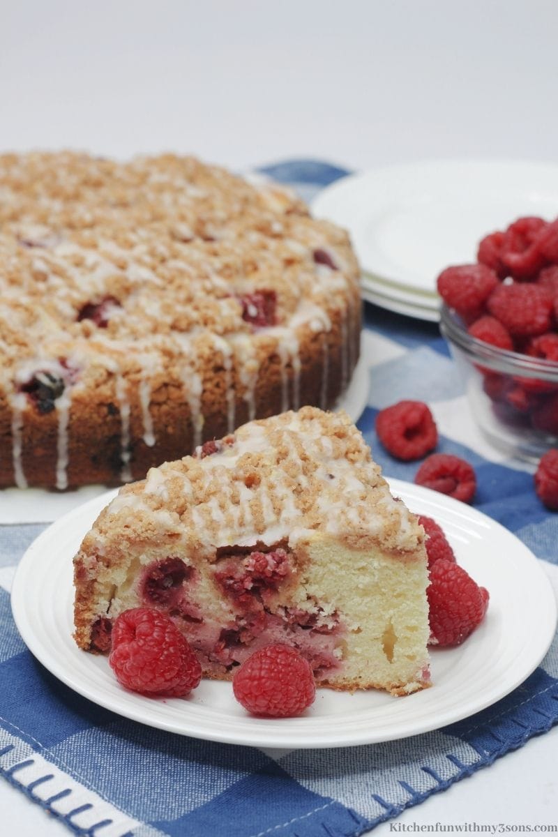 Raspberry Crumble Cake on a white and blue cloth.