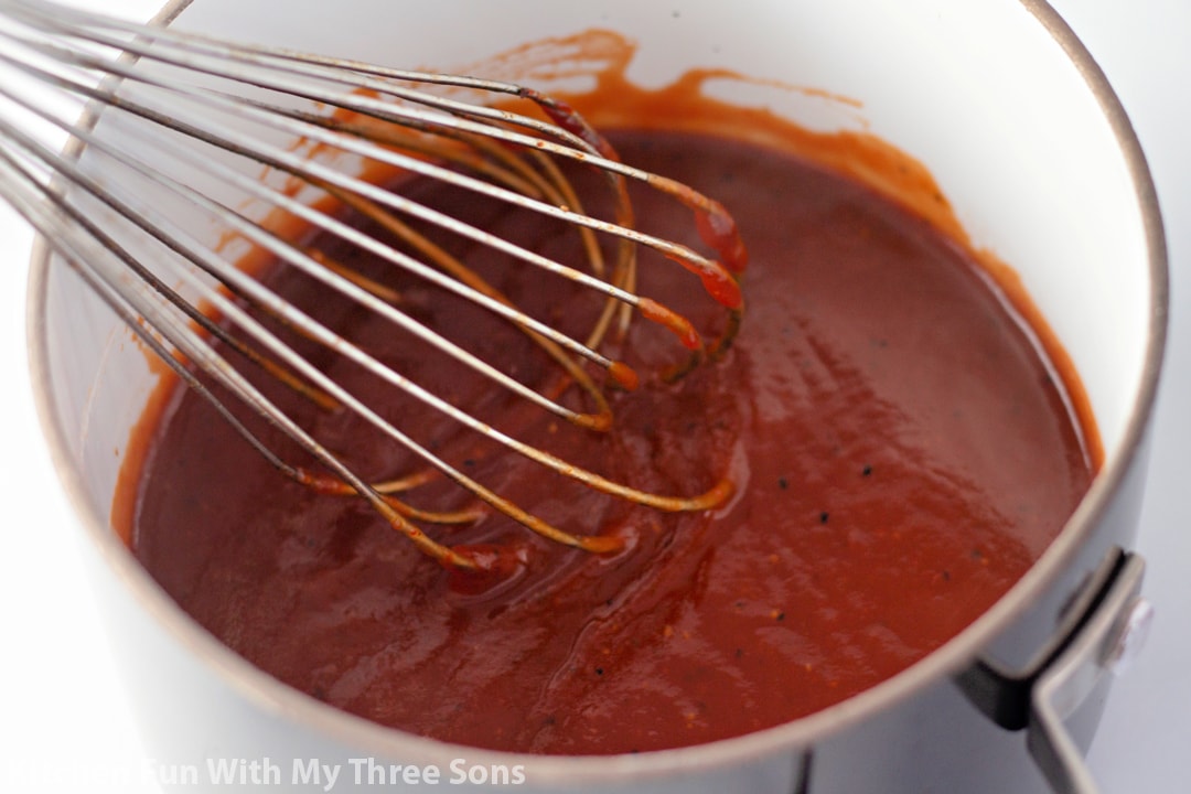 A whisk in homemade BBQ sauce