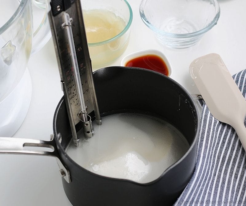 Heating the sugar in a saucepan.