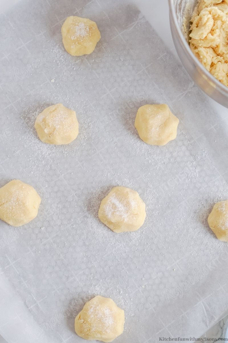 Arranging the dough balls on to the prepared sheet.