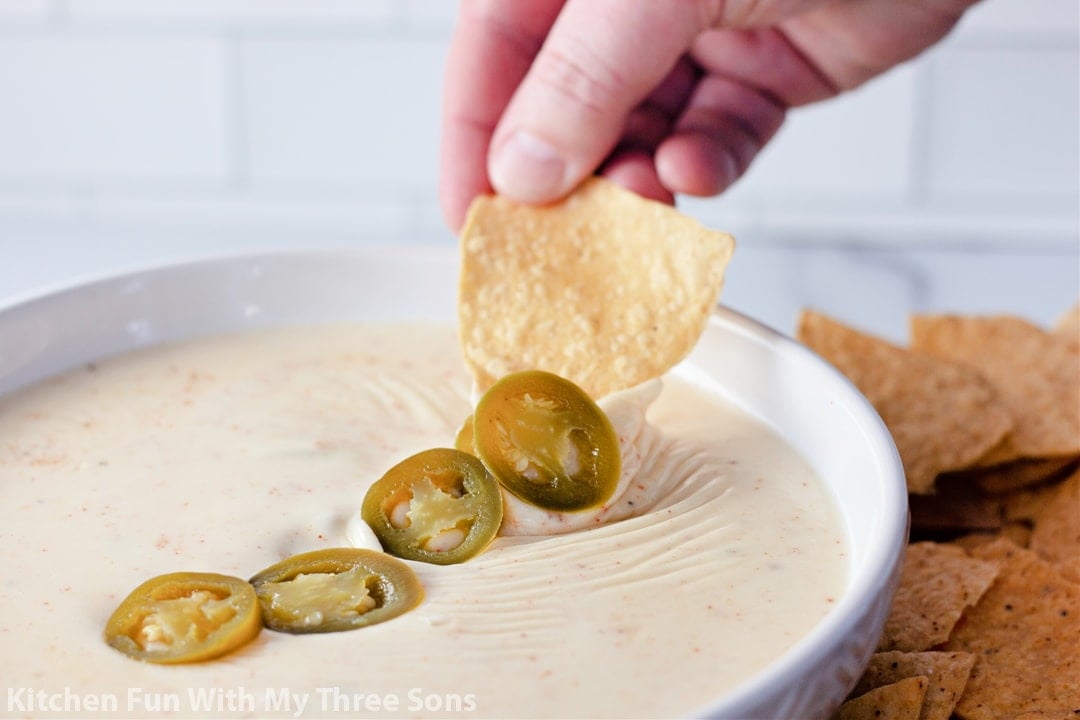 jalapenos on top of queso dip