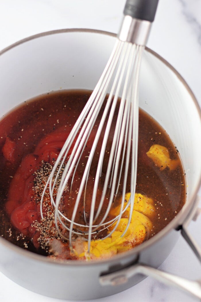 mixing sauce ingredients in a pot