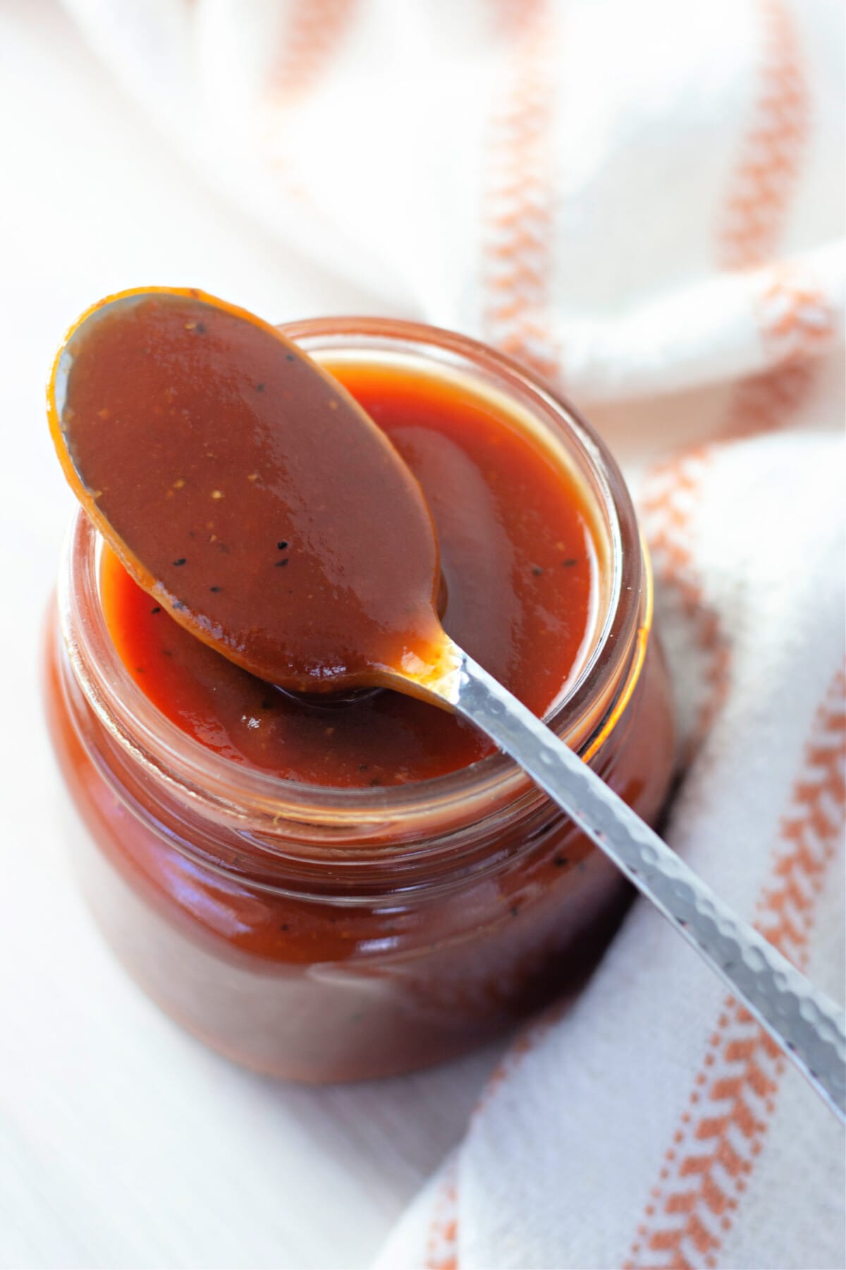 a spoon with homemade barbecue sauce