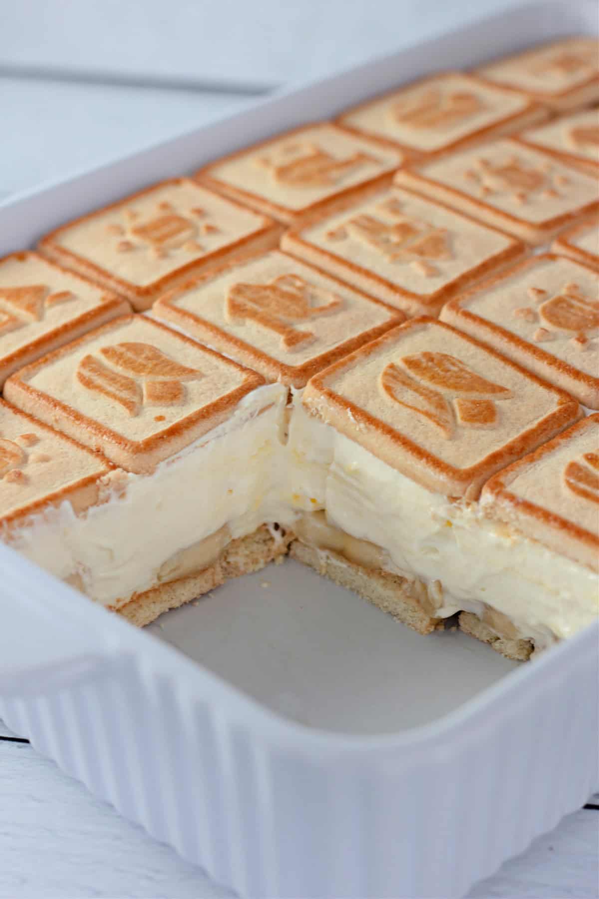 This Not Yo Mama's Banana Pudding is the ultimate no-bake treat that combines simplicity with indulgence! With buttery Chessmen Cookies as the base, layers of fresh banana slices, and a creamy mixture of whipped cream cheese, vanilla pudding, Cool Whip, and sweetened condensed milk, every bite is a creamy delight. Not Yo Mama's Banana Pudding in a baking dish