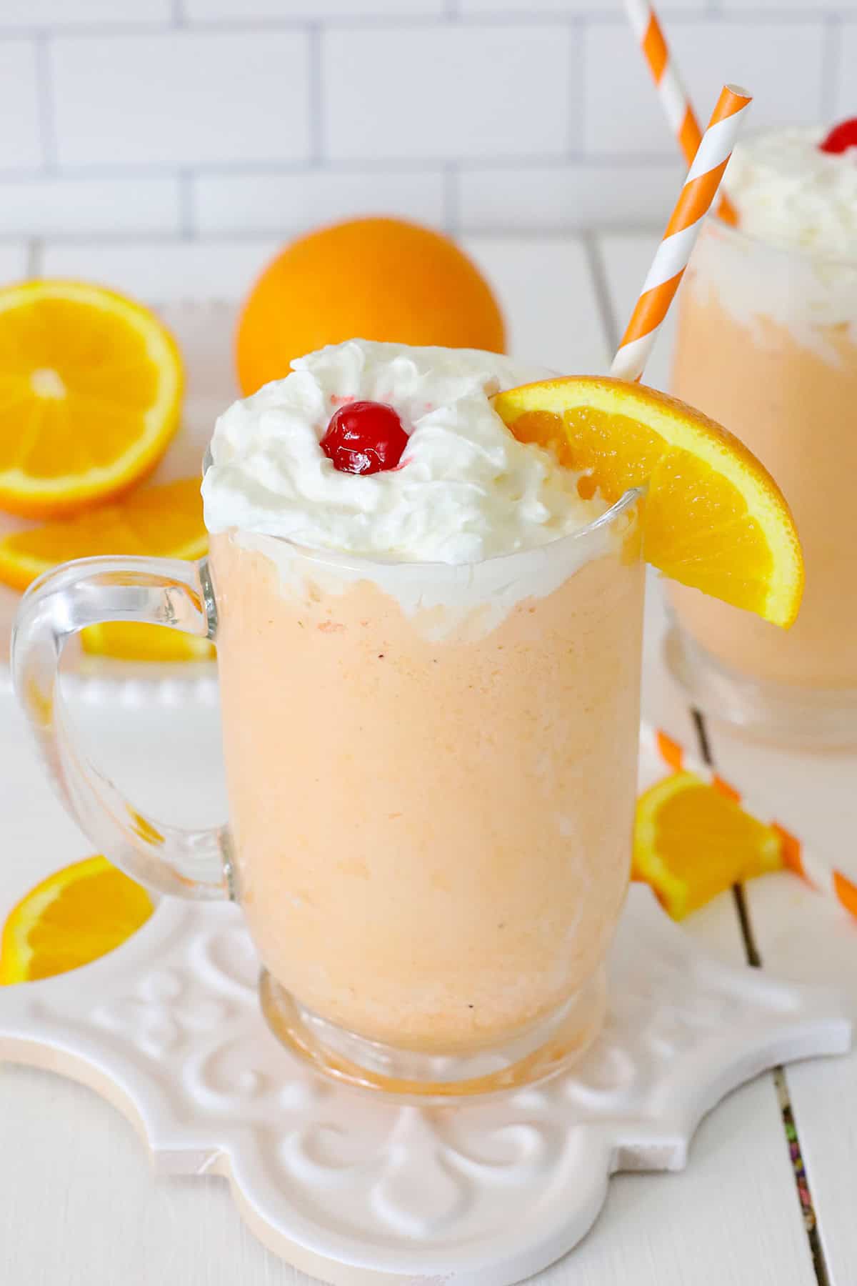 This 3-ingredient Orange Creamsicle Shake is a yummy mix of creamy vanilla ice cream and a punch of orange soda that makes this classic flavor combo. Orange Creamsicle Shake