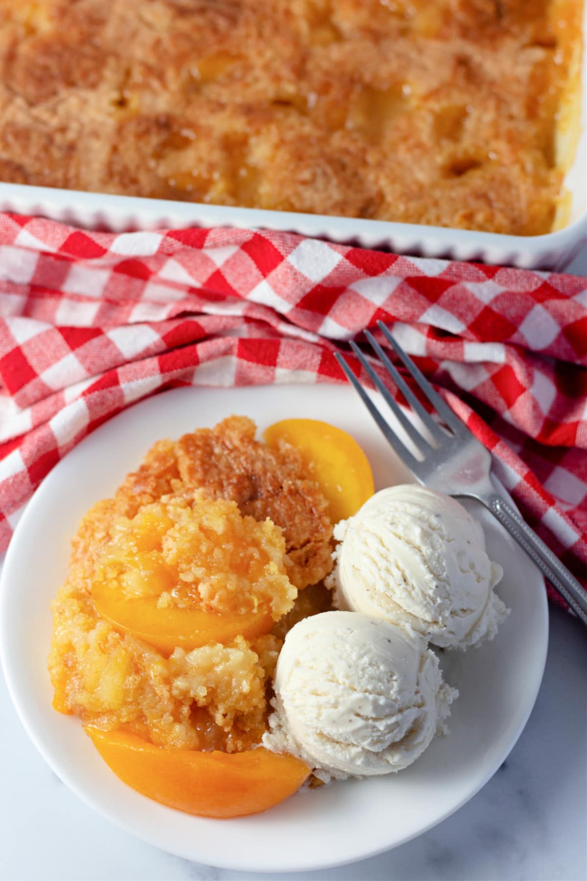 Top view of Peach Dump Cake with ice cream