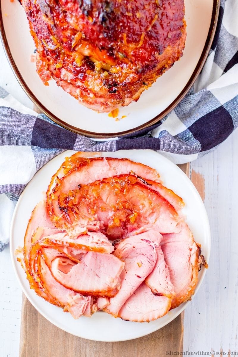 Some slices of the ham on a serving plate.
