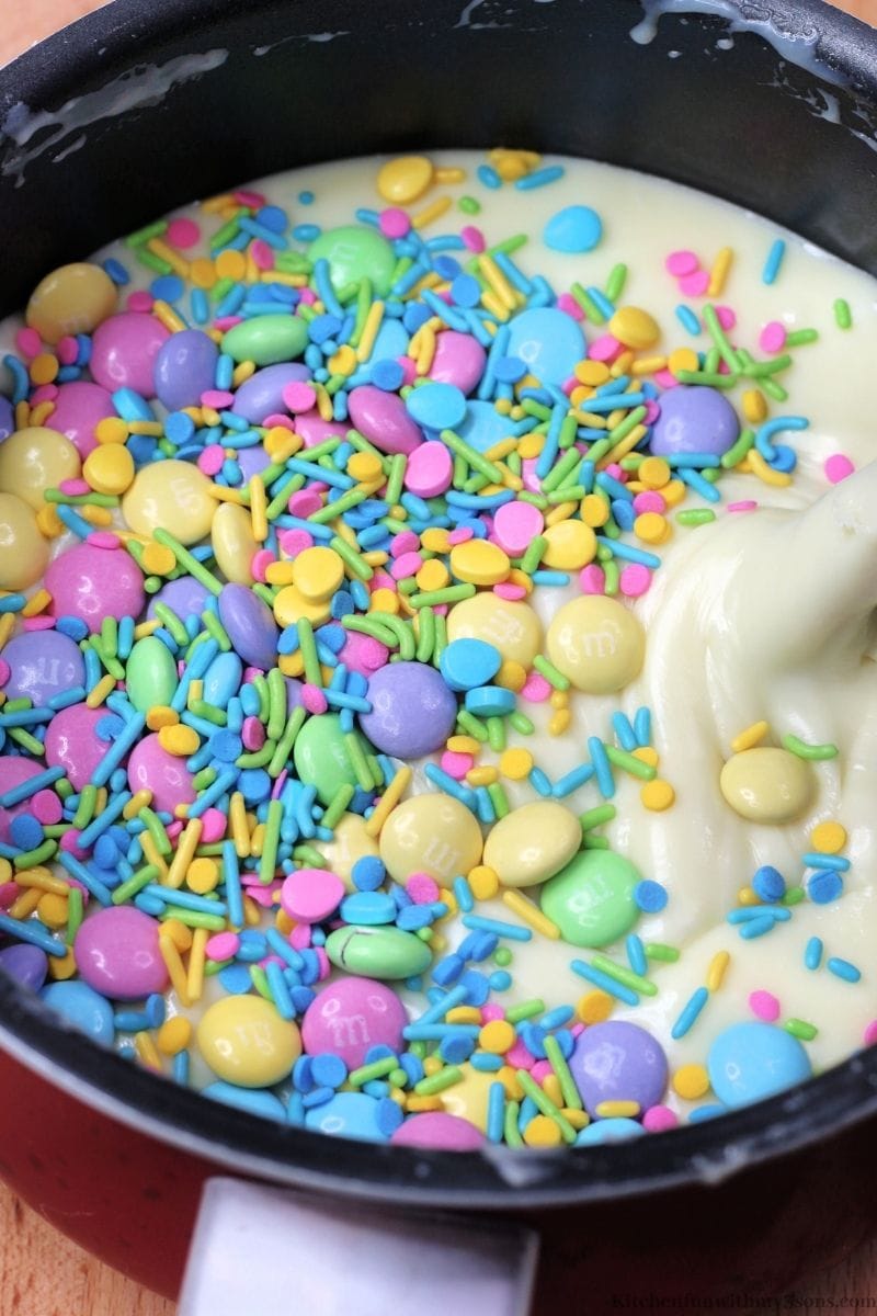 Adding the candies and sprinkles into the batter.