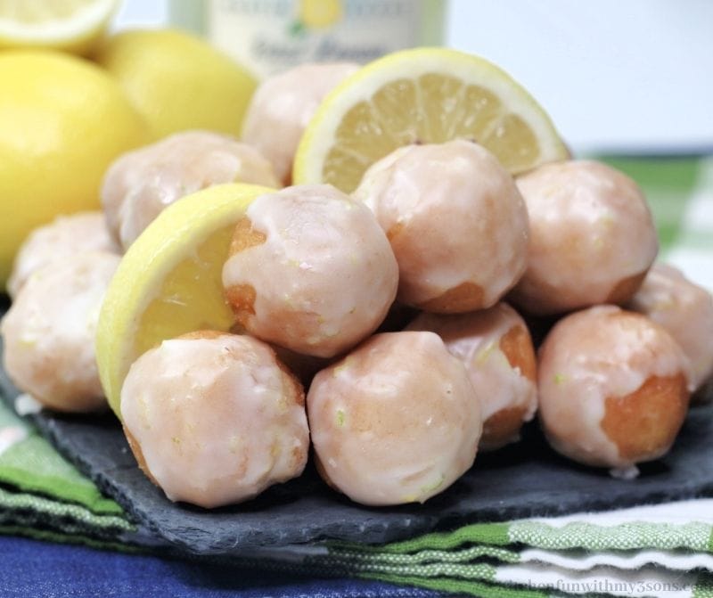 Lemon Donut holes stacked in a pile.