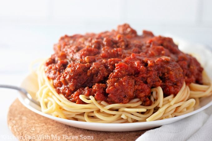 The Best Homemade Meat Sauce with spaghetti on a white plate.