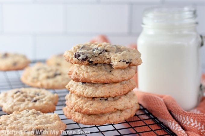 stacked Chewy Oatmeal Raisin Cookies with milk.
