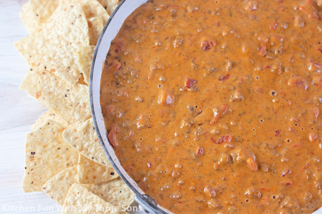 Rotel Dip with Ground Beef with tortilla chips.