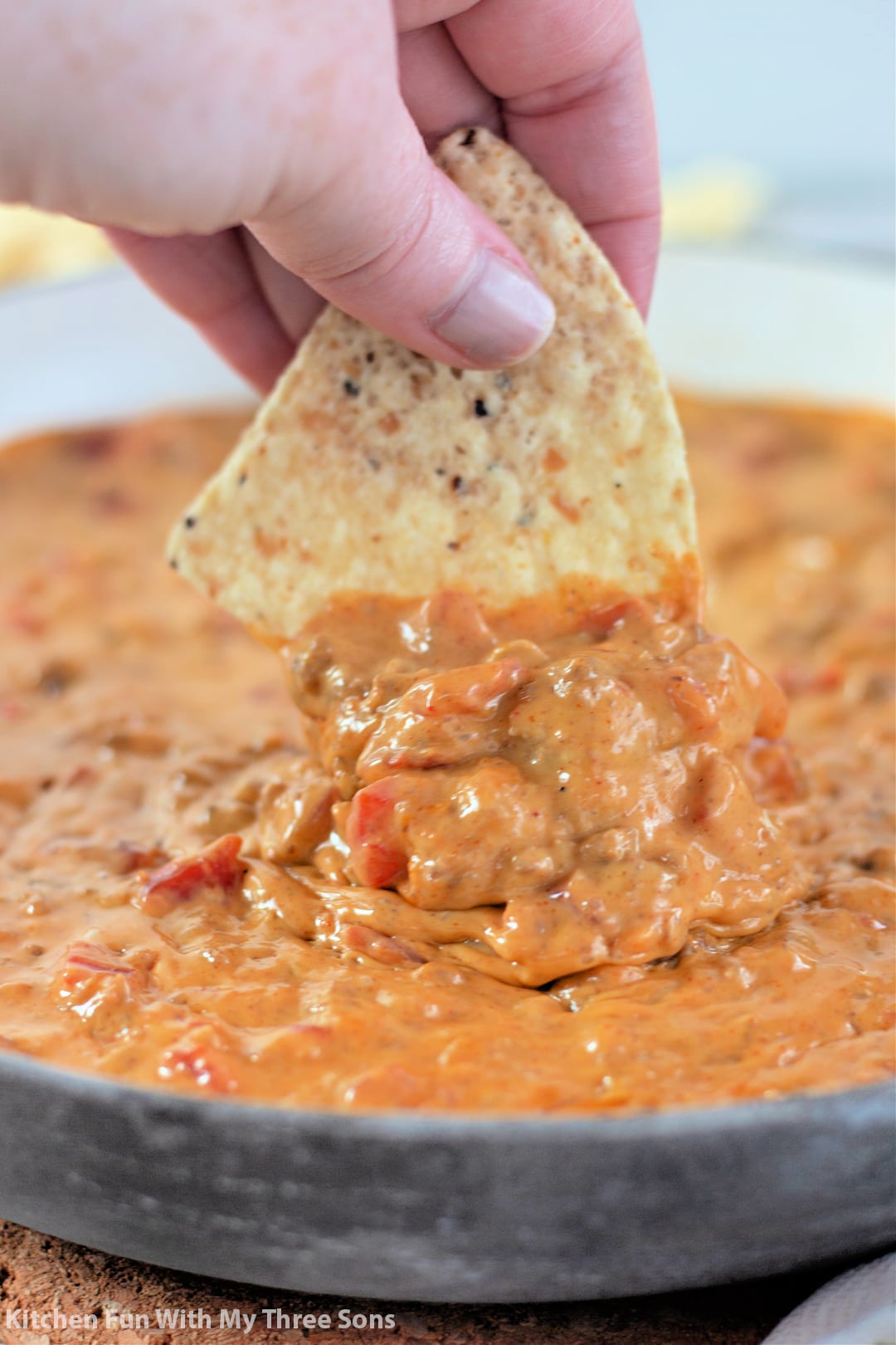 dipping a chip into homemade Rotel.
