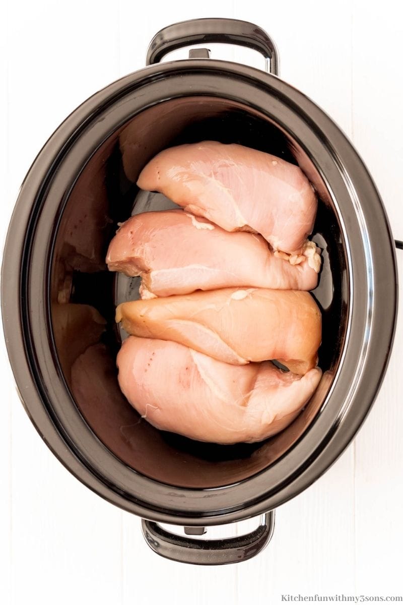 The raw chicken in the slow cooker.