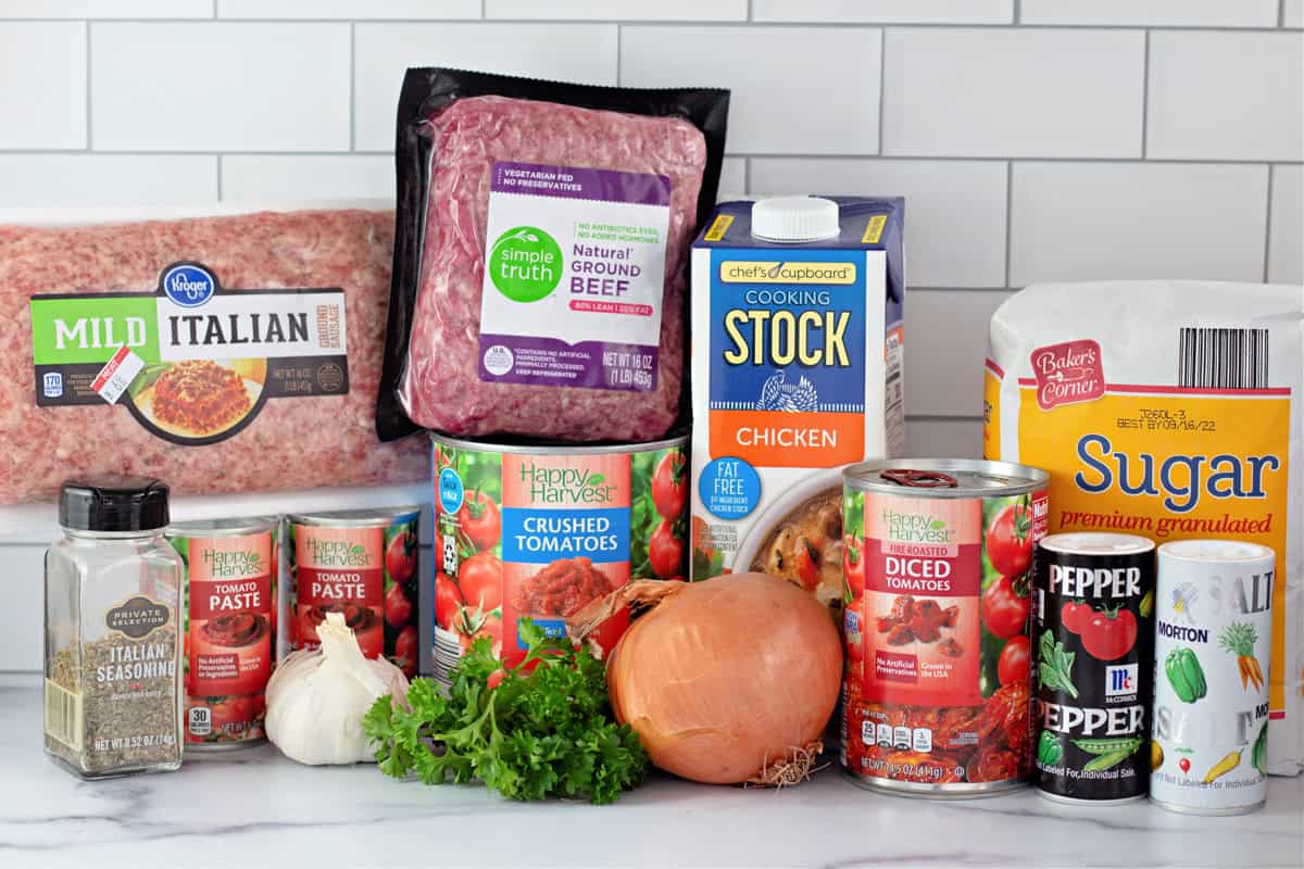 Italian sausage and ground beef are simmered with crushed and fire roasted tomatoes to make this the BEST Spaghetti Meat Sauce recipe. Ingredients needed to make spaghetti meat sauce