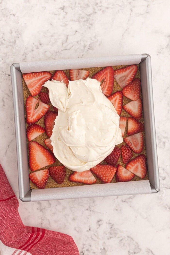 Cream cheese mixture on top of sliced strawberries
