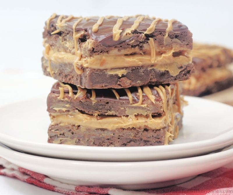 A side view of two brownies stacked on top of each other.