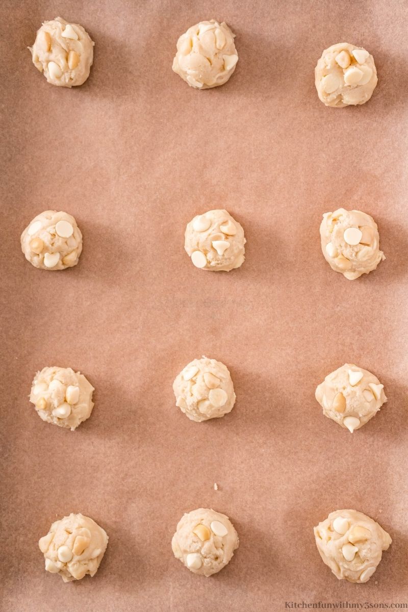 The cookie dough balls arranged on the prepared sheet.