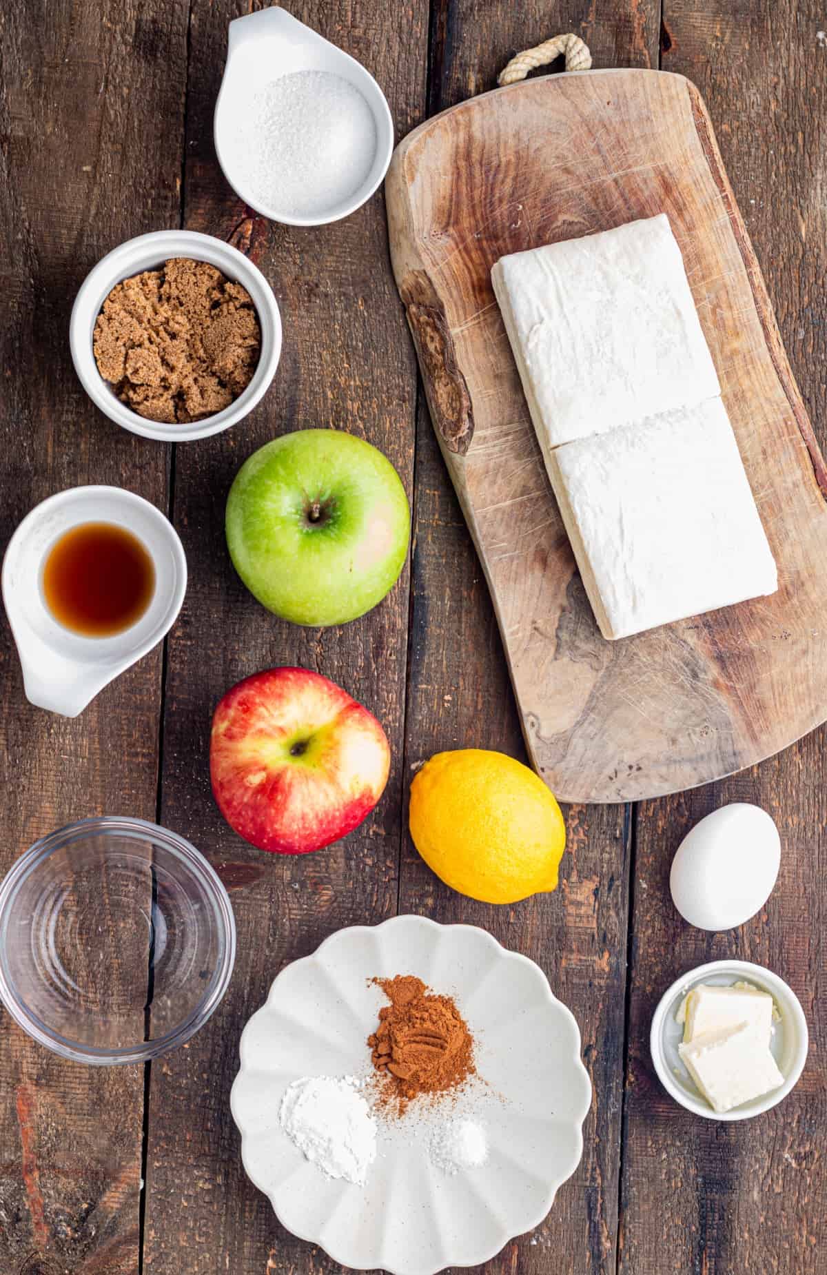 These Apple Hand Pies are filled with gooey apple pie filling wrapped in flaky puff pastry and baked until deeply golden and crisp. overhead view of ingredients needed to make apple hand pies