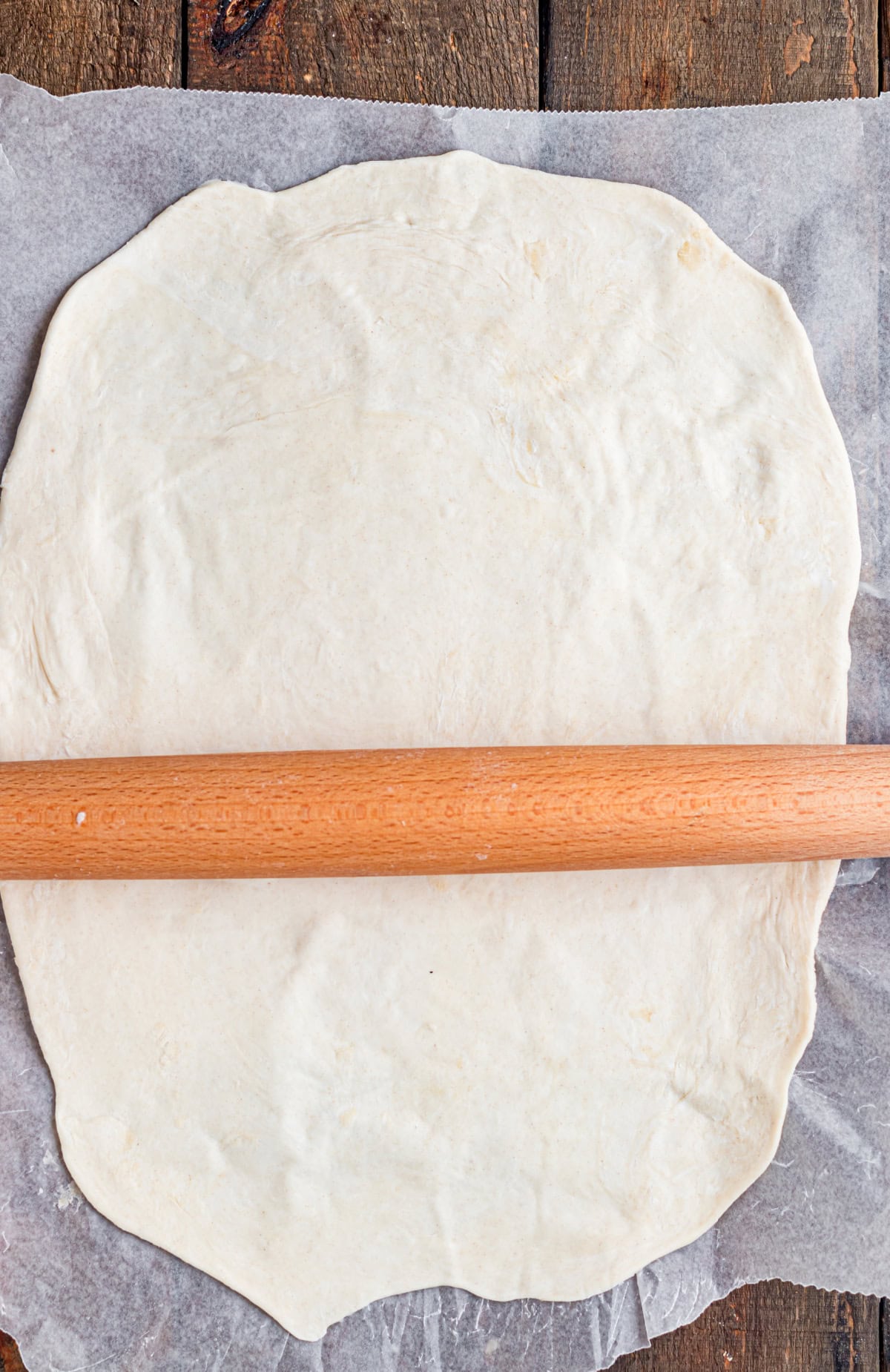 These Apple Hand Pies are filled with gooey apple pie filling wrapped in flaky puff pastry and baked until deeply golden and crisp. rolling out a puff pastry sheet.