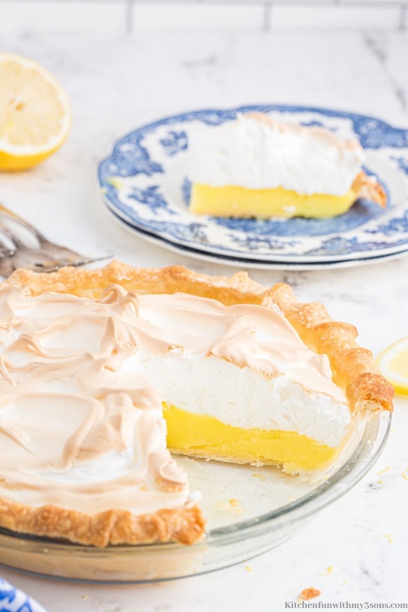 A piece of lemon pie taken on and placed on a serving plate.